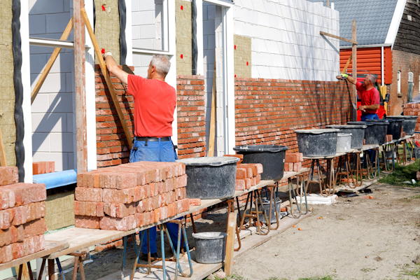 bricklayers working at a new house
